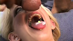 Three black studs pound the sexy blonde's fiery holes and fill her mouth with cum